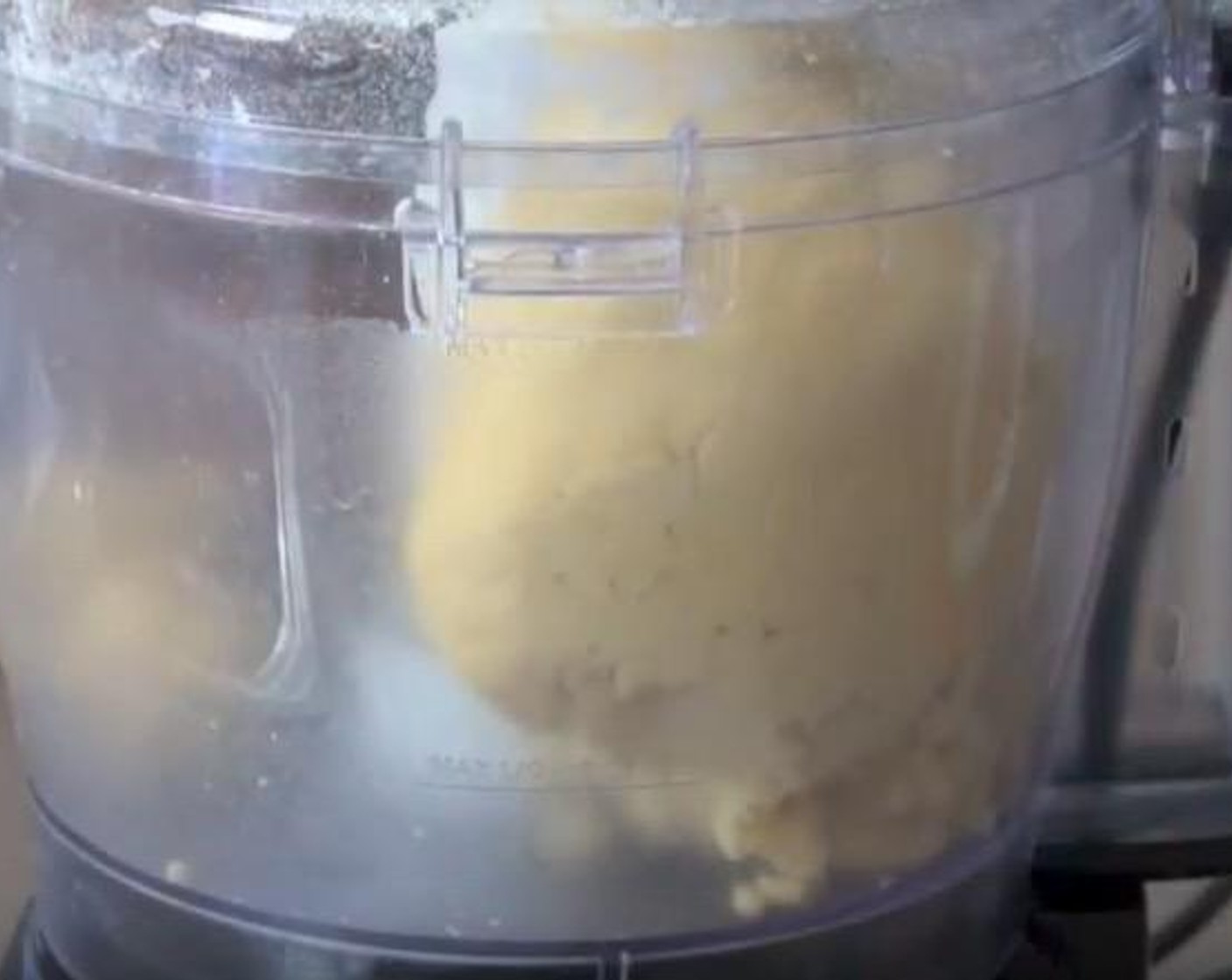 step 2 Add Eggland's Best Classic Egg (1) yolk and Water (3 Tbsp). Process again until mixture comes together as dough.