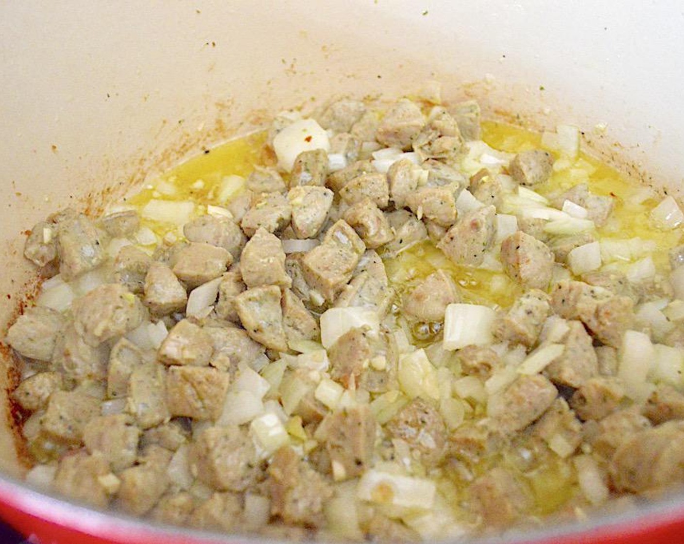 step 3 Add in the Garlic (4 cloves) and Onion (1), and let them soften and get fragrant for a couple of minutes. Pour in the White Wine (1/3 cup) and scrape up all of the brown bits.