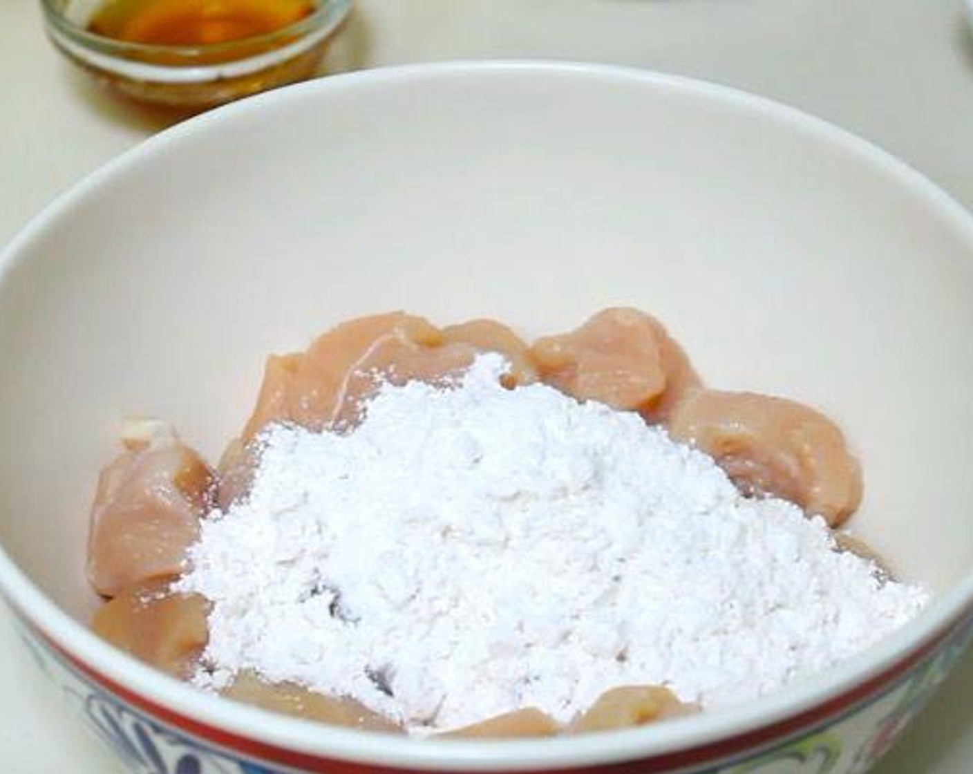 step 1 Cut Chicken Breasts (2) into 1-inch pieces. Coat with All-Purpose Flour (4 Tbsp)