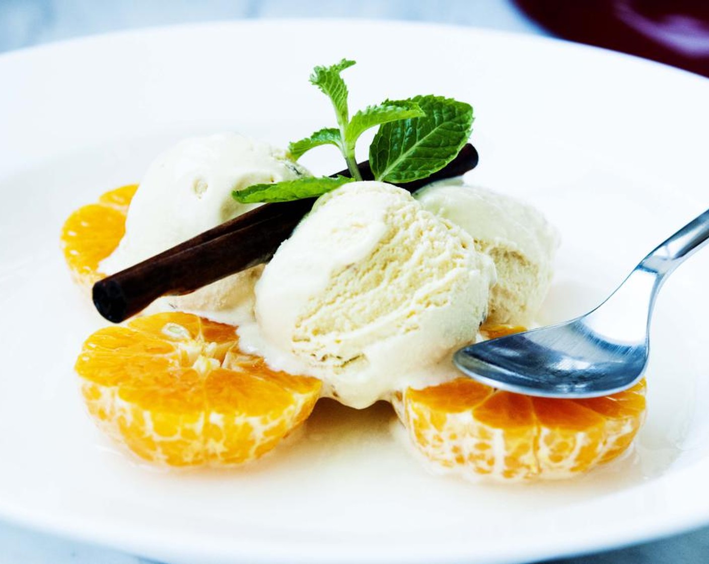 Vanilla Ice Cream with Clementines in Cinnamon Syrup