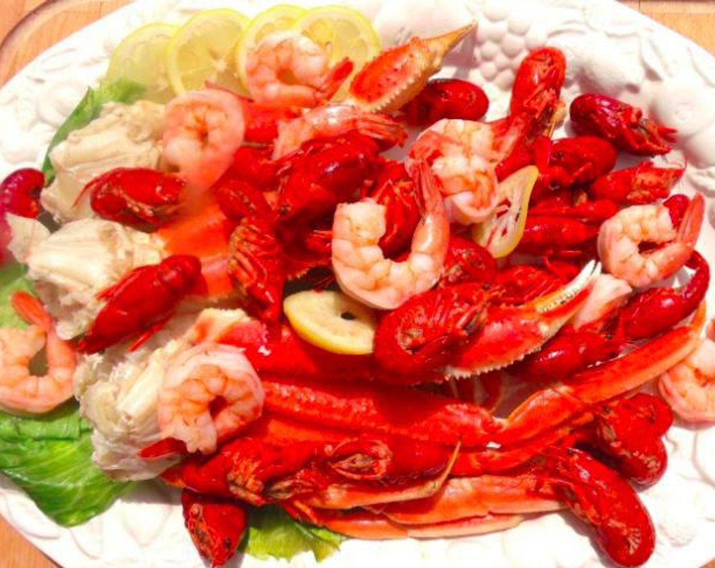 step 4 Plate seafood on a serving platter, drizzle with Butter (1/2 cup) and 2 cups of the seafood stock, serve with horseradish or Sweet Chili Sauce (to taste). Serve as appetizer or generous main course.