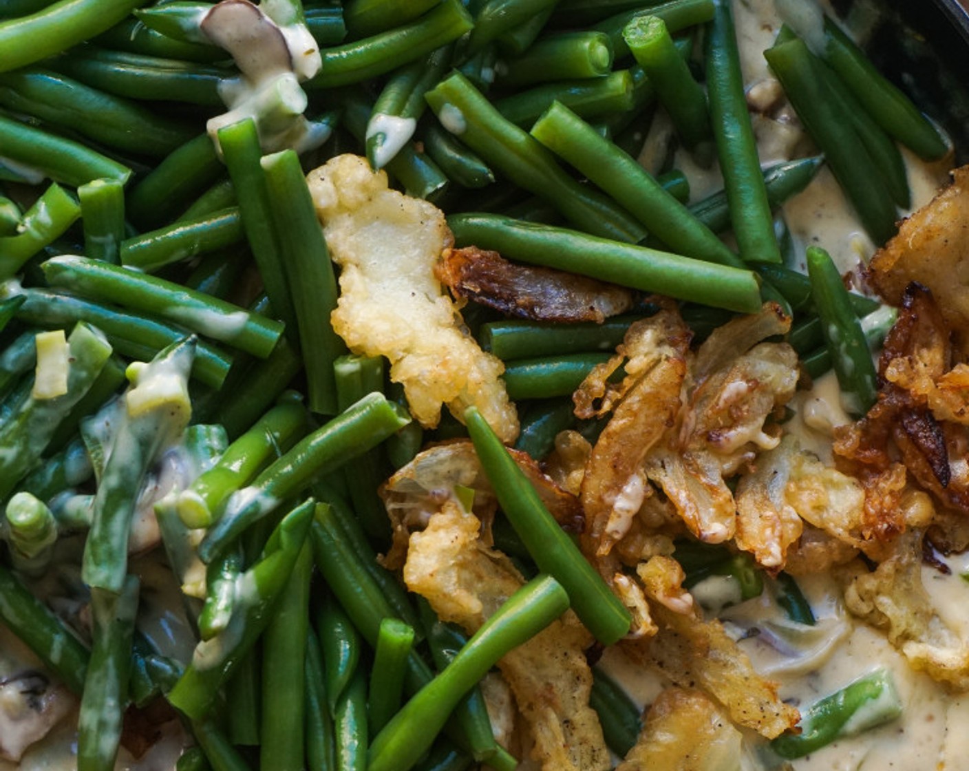 step 14 Stir in the green beans and a quarter of the fried onions. Transfer to a baking dish and bake for 15 minutes or until bubbly.