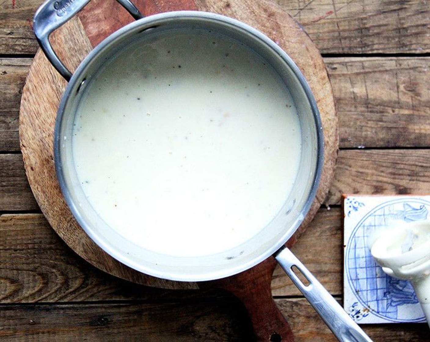 step 5 When potatoes are tender, add milk mixture to the pot. Purée using a blender. Season with Salt (to taste) and Ground Black Pepper (to taste). Bring soup to a gentle simmer, stirring to ensure it isn't sticking to the ​bottom ofthe ​ pot.