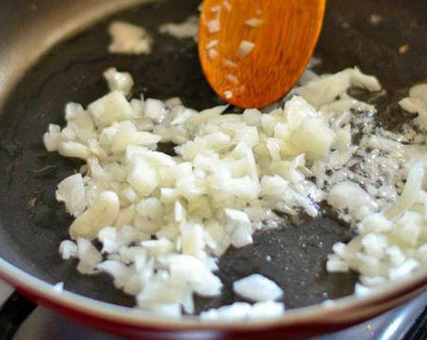 step 2 Sauté Onion (1) in one tablespoon of Canola Oil (as needed) until translucent. Add Garlic (1 clove) and sauté until fragrant.