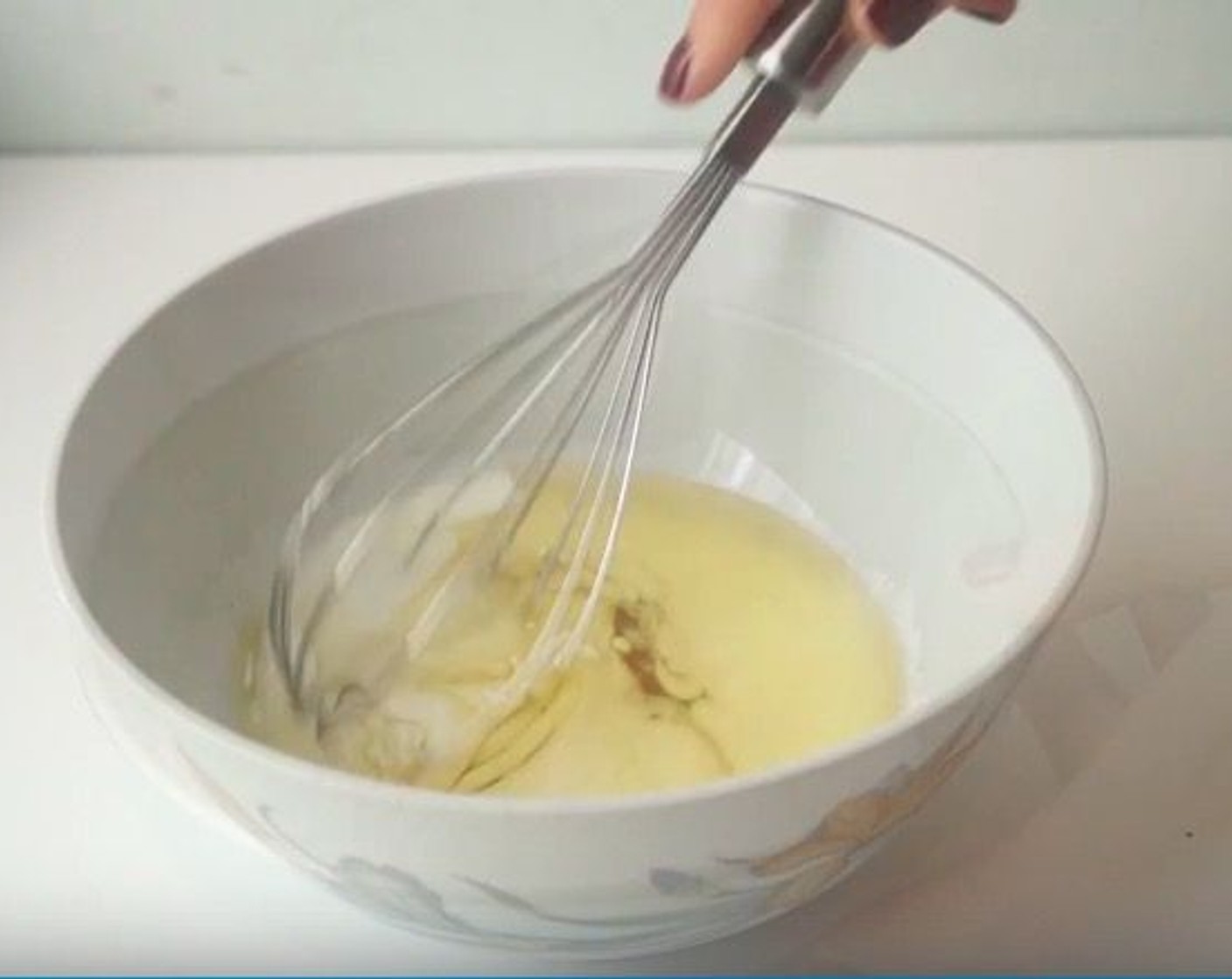step 3 In a separate bowl, beat together the Maple Syrup (2.5 oz), Soy Milk (3.5 oz), and Vegetable Oil (2 oz) with a whisk until thoroughly combined.
