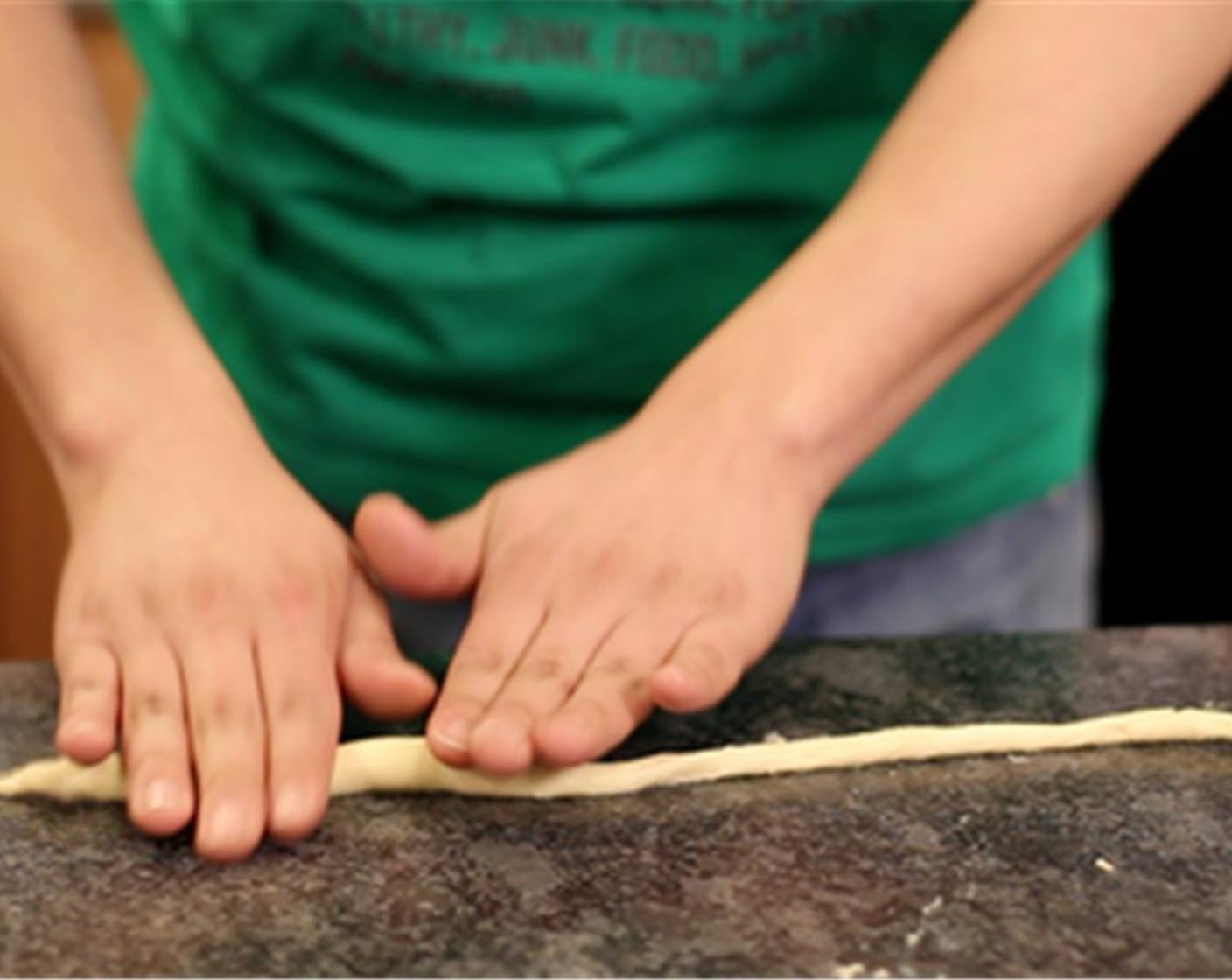 step 3 Pop open the Pillsbury™ Crescent Rounds (1), which are actually triangle. Take your triangle and roll it until it's a long skinny dough.