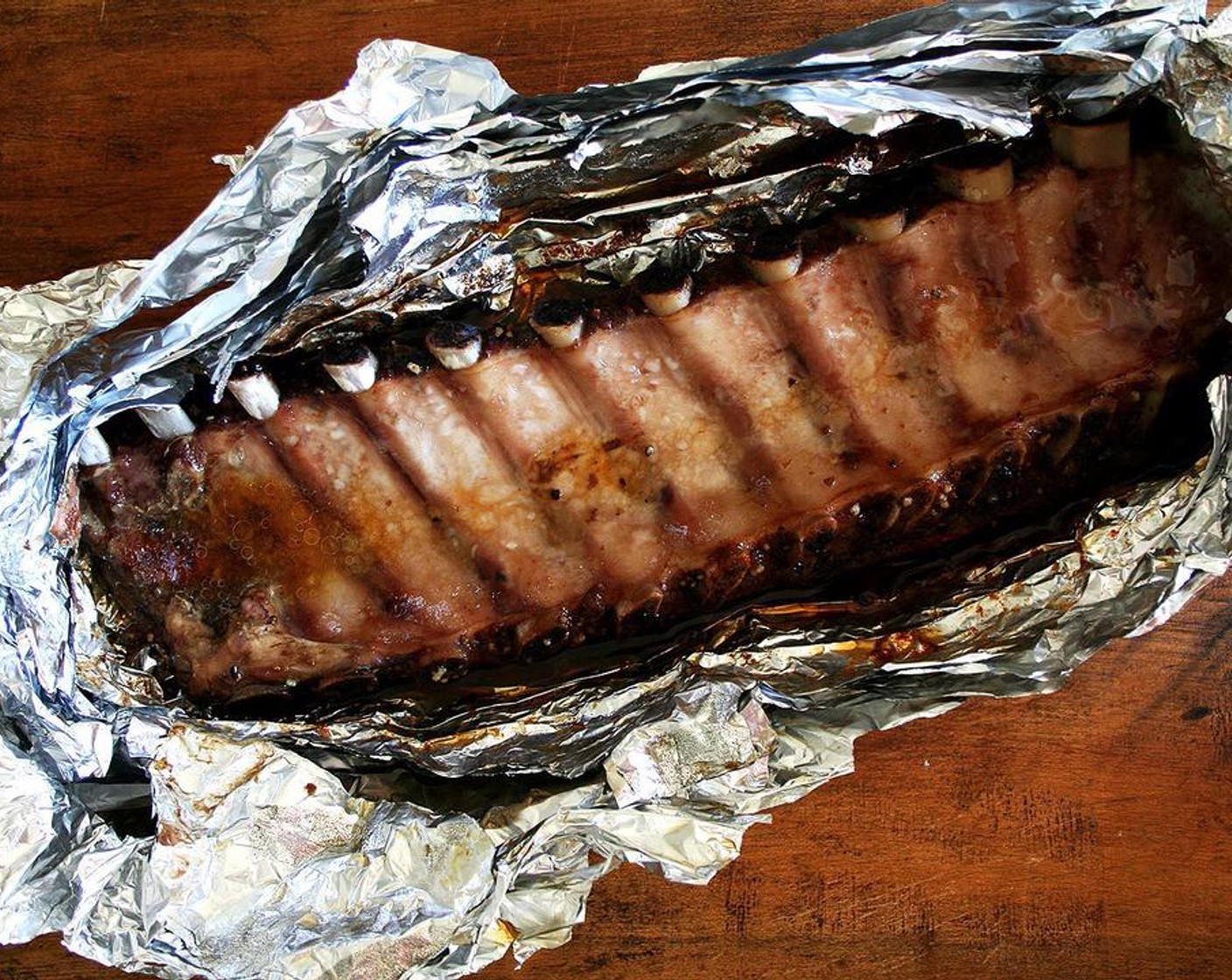 step 6 When ready to serve, reheat the ribs in the oven for about 15 minutes at 350 degrees F (180 degrees C). This is assuming the ribs have not been refrigerated. Or, open the pouch, baste the ribs with the juices and place them under the broiler for five minutes.