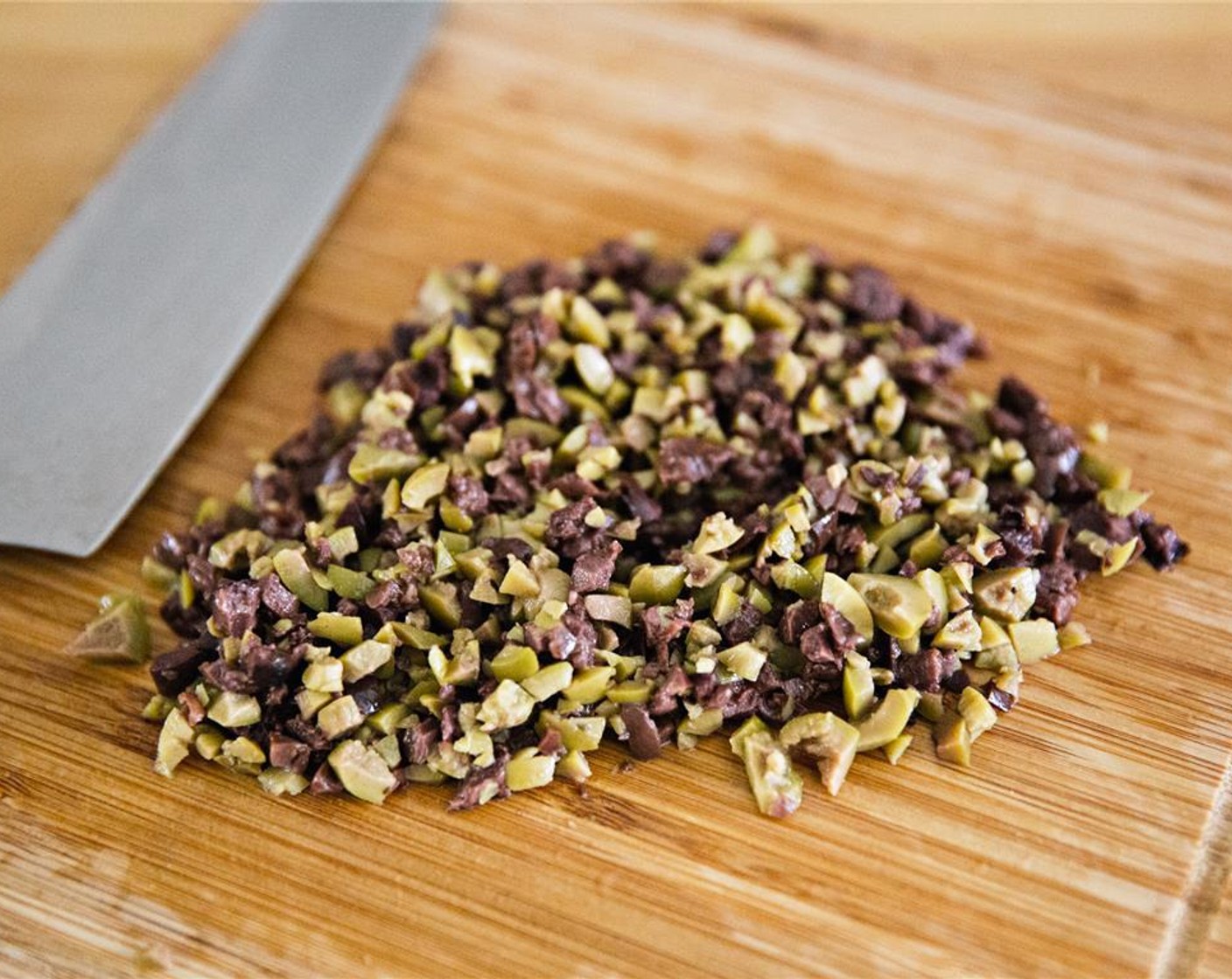 step 3 Finely chop the Black Olives (1/4 cup) and the Green Olives (1/4 cup).