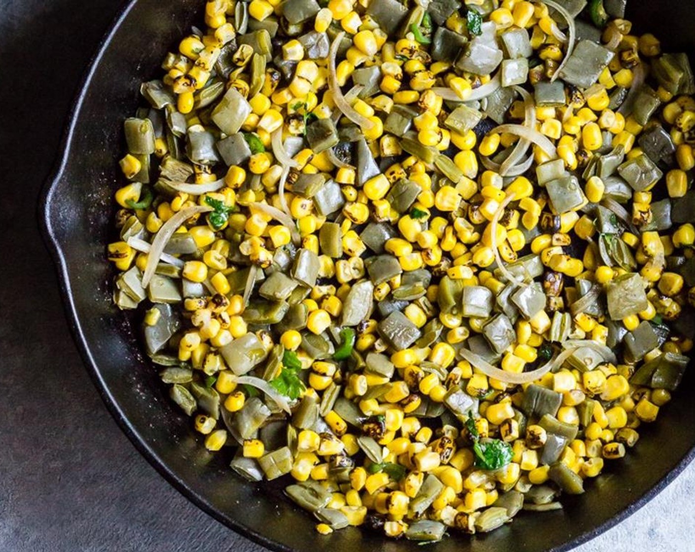 step 8 Add Fire Roasted Corn Kernels (1 1/2 cups) (thawed to room temp if using frozen corn) to the skillet and cook with the nopales for a few minutes until heated through - turn off heat and leave skillet on the stovetop to stay warm while you prepare the tacos.