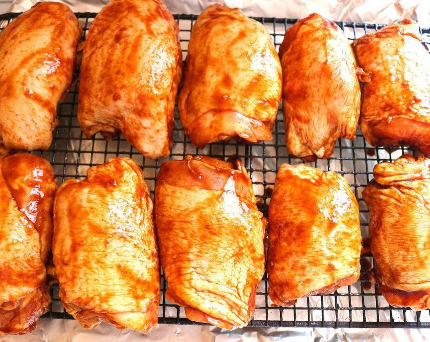 step 5 Place the thighs on a baking rack over a tray with 1/3 inch water, bake in the preheated oven until cooked through, about 30 to 40 minutes, depending on the size of the chicken.