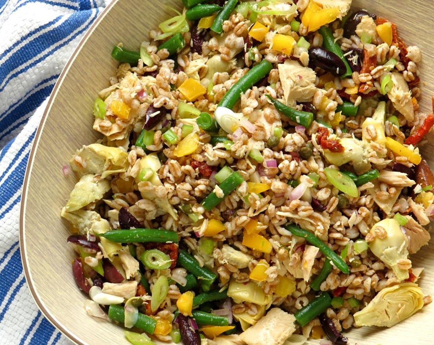 step 18 Add the farro to the vegetables and toss. Add the vinaigrette and toss so that vegetables and farro are coated with the dressing.