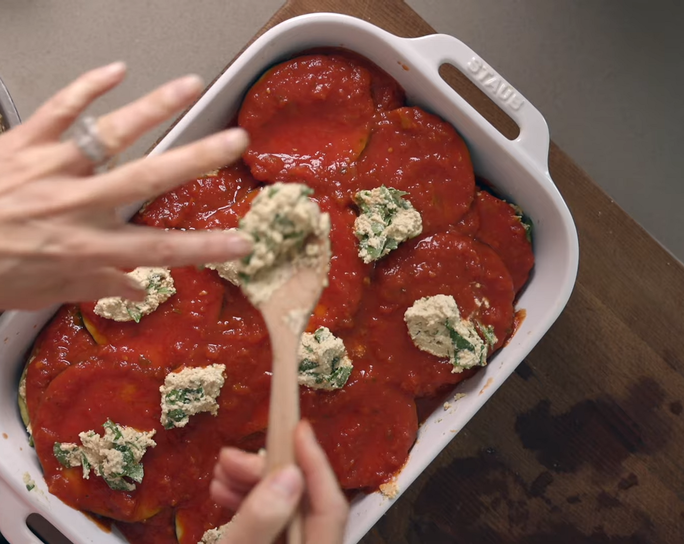 step 9 Add sauce on top of the spinach cashew ricotta layer. Add another layer of eggplant and continue until the final layer. For the final layer, add the last bit of spinach cashew ricotta on top of the sauce in dollops.