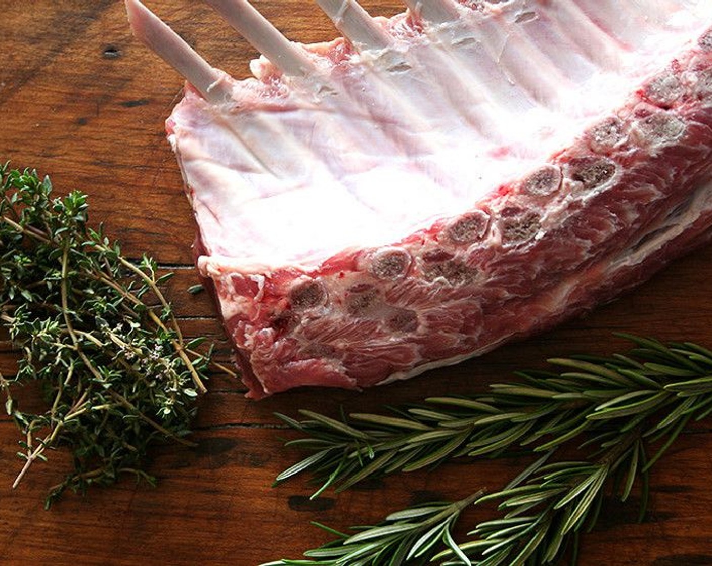 step 2 Place Lamb (1 rack) on a parchment-lined (for easy clean-up) rimmed baking sheet. Season with Kosher Salt (to taste) and Freshly Ground Black Pepper (to taste) on all sides.