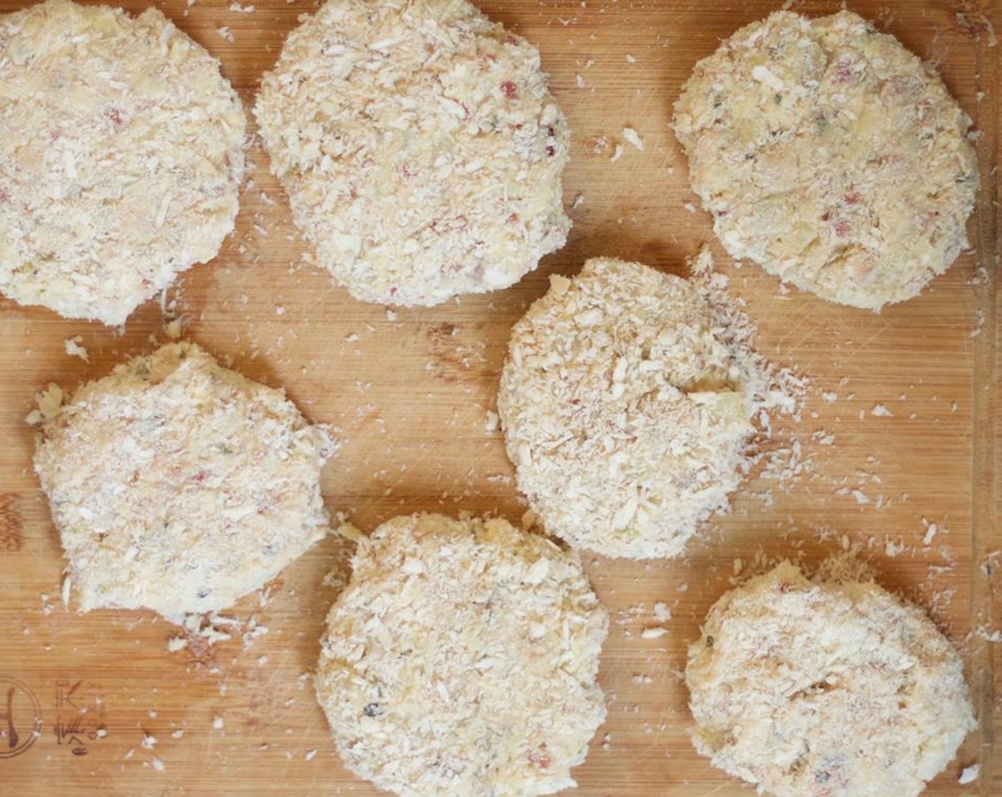 step 9 Add the Panko Breadcrumbs (1 cup) to a shallow bowl. With your hands, form 3 tablespoon of the mixture into disks. Add the disks to the breadcrumbs one at a time, and turn to coat. Arrange on a cutting board or baking sheet, and refrigerate for 10 minutes.