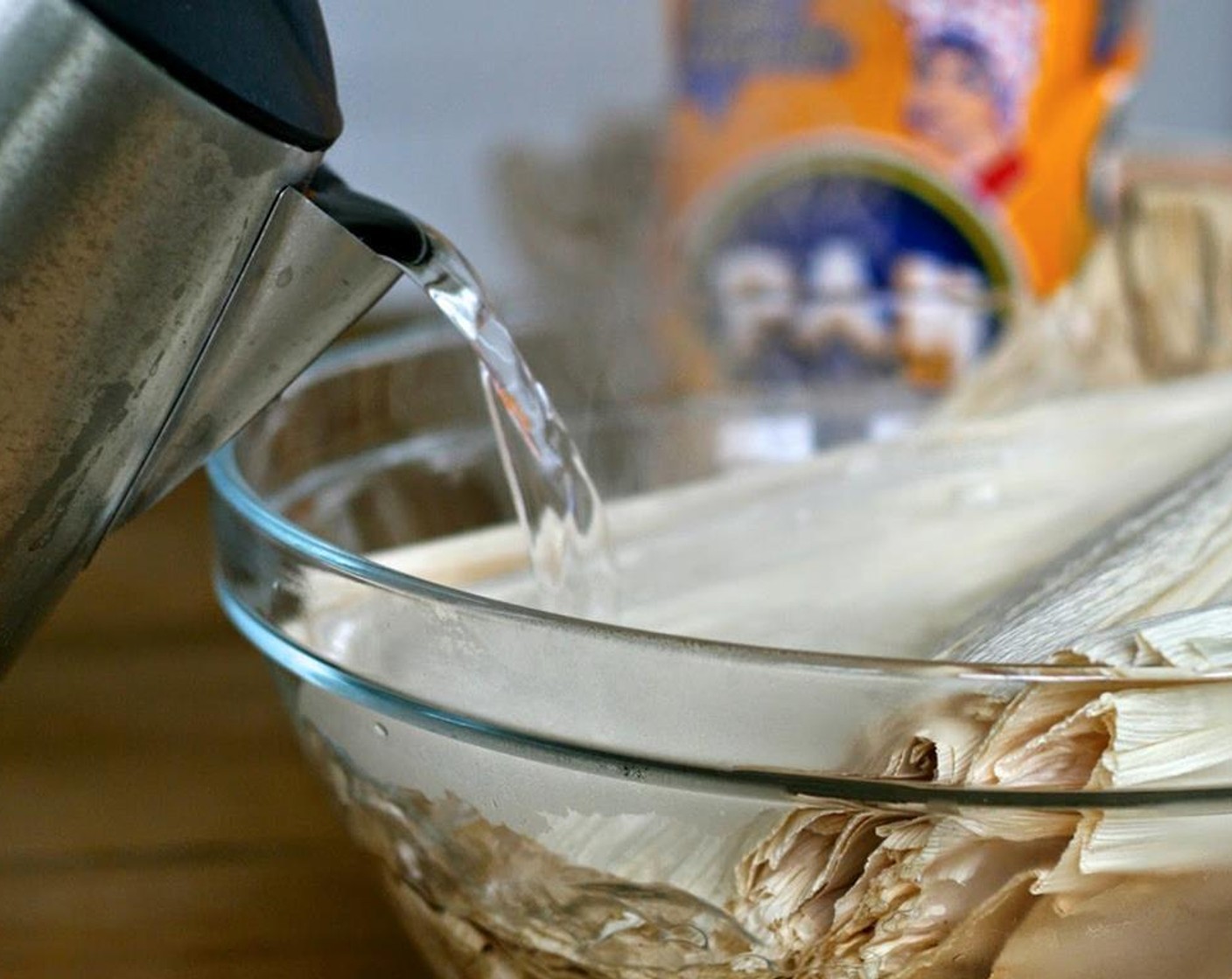 step 1 In a large bowl, pour boiling Water (to taste) over Corn Husks (30 pieces). Weigh down with a plate and/or heavy object to keep husks submerged for 30 to 60 minutes.