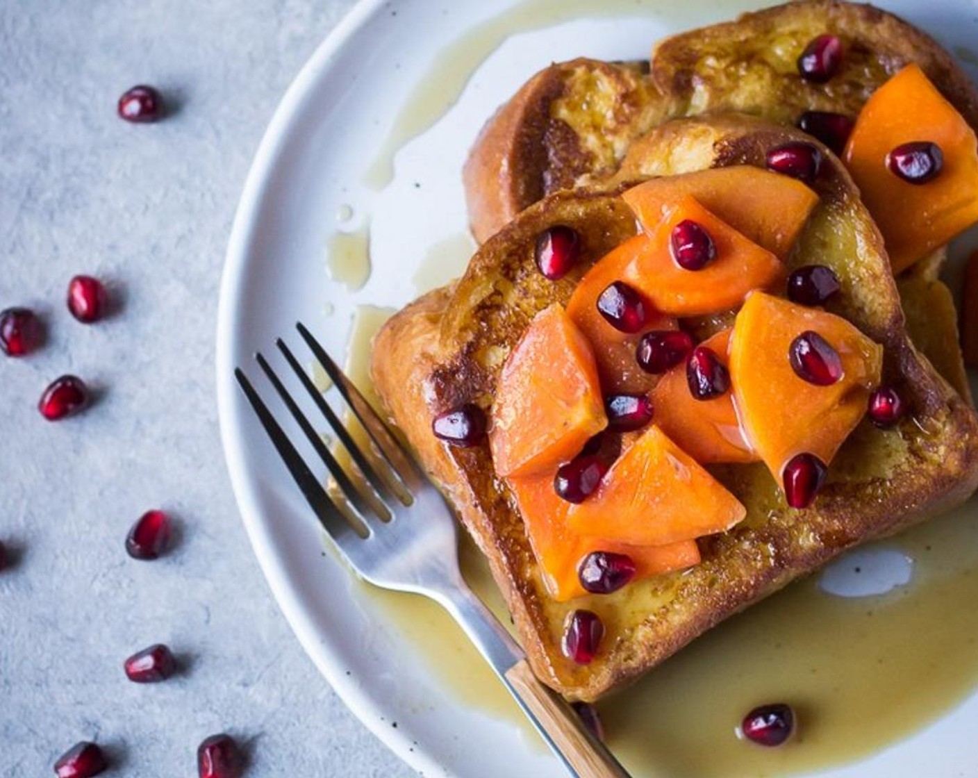 step 7 Serve topped with warm persimmons, a drizzle of Maple Syrup (to taste) and a sprinkle of Pomegranate (1).