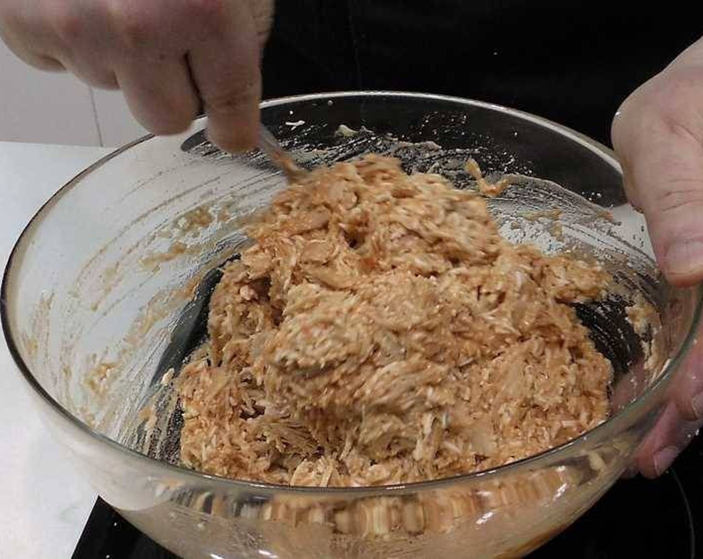 step 3 In a large bowl add the Canned Tuna in Olive Oil (1 cup), grate the Eggs (6) and add Tomato Sauce (to taste). You want the mixture to be wet but still hold its shape, so start with less, mix, then add more if needed. Mix thoroughly.