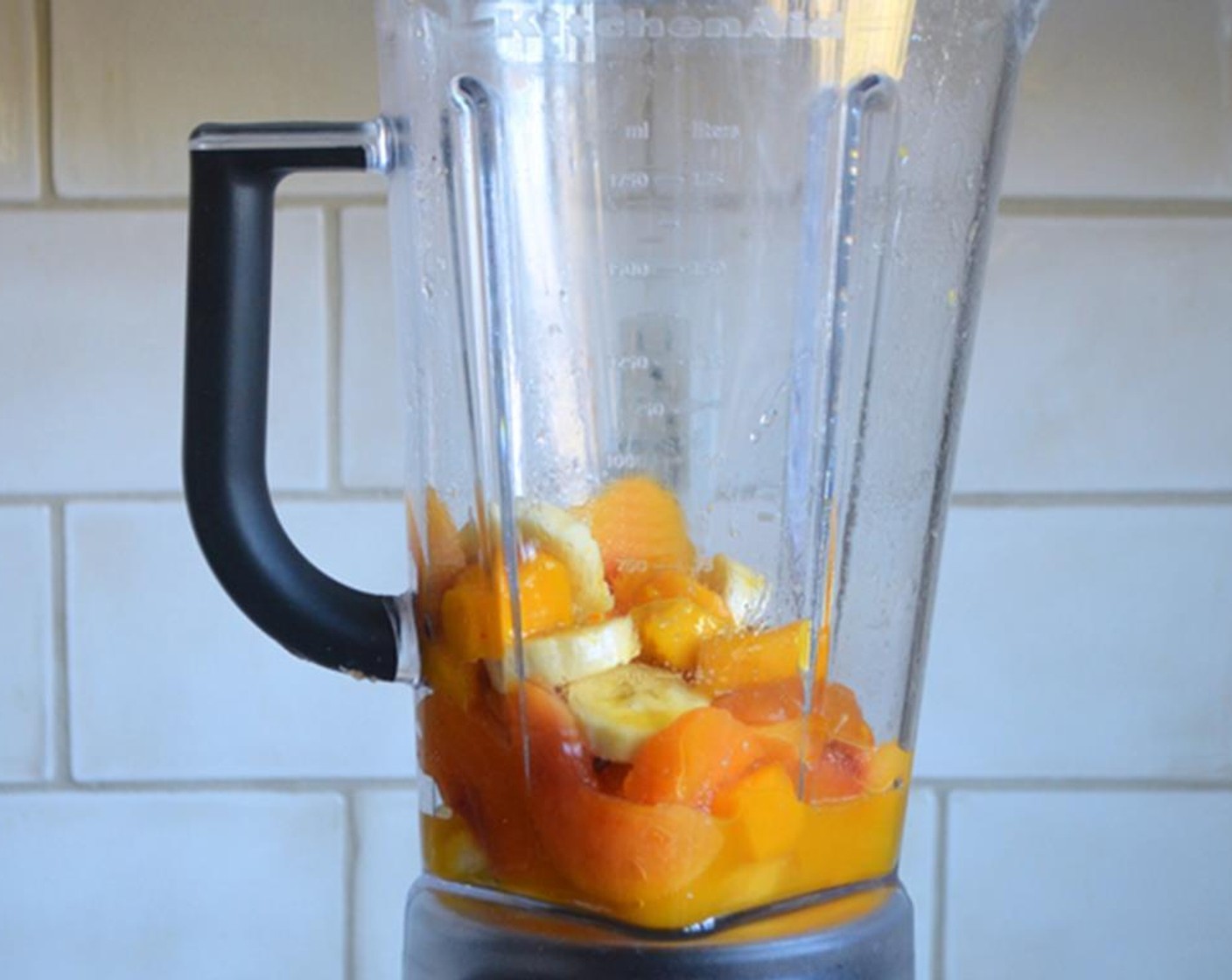 step 1 Combine Peach (1 cup), Mango (1/2 cup), Mango Nectar (1/4 cup), Banana (1/2), Granulated Sugar (1/2 Tbsp), if using, and Ice (to taste) in a blender.