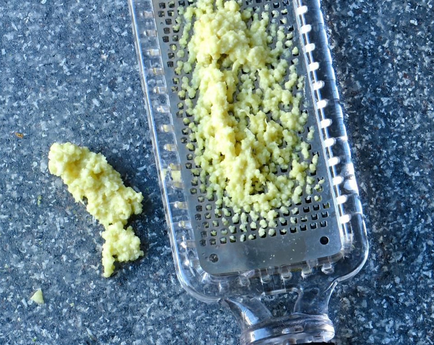 step 9 Use a microplane grater to grate the ginger onto a cutting board.