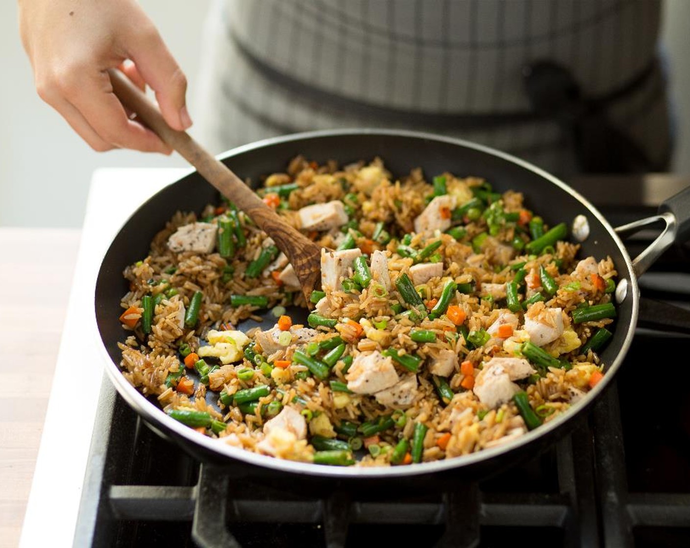 step 13 Divide the Teriyaki Chicken Fried Rice between two bowls, garnish with remaining scallions and serve and enjoy!