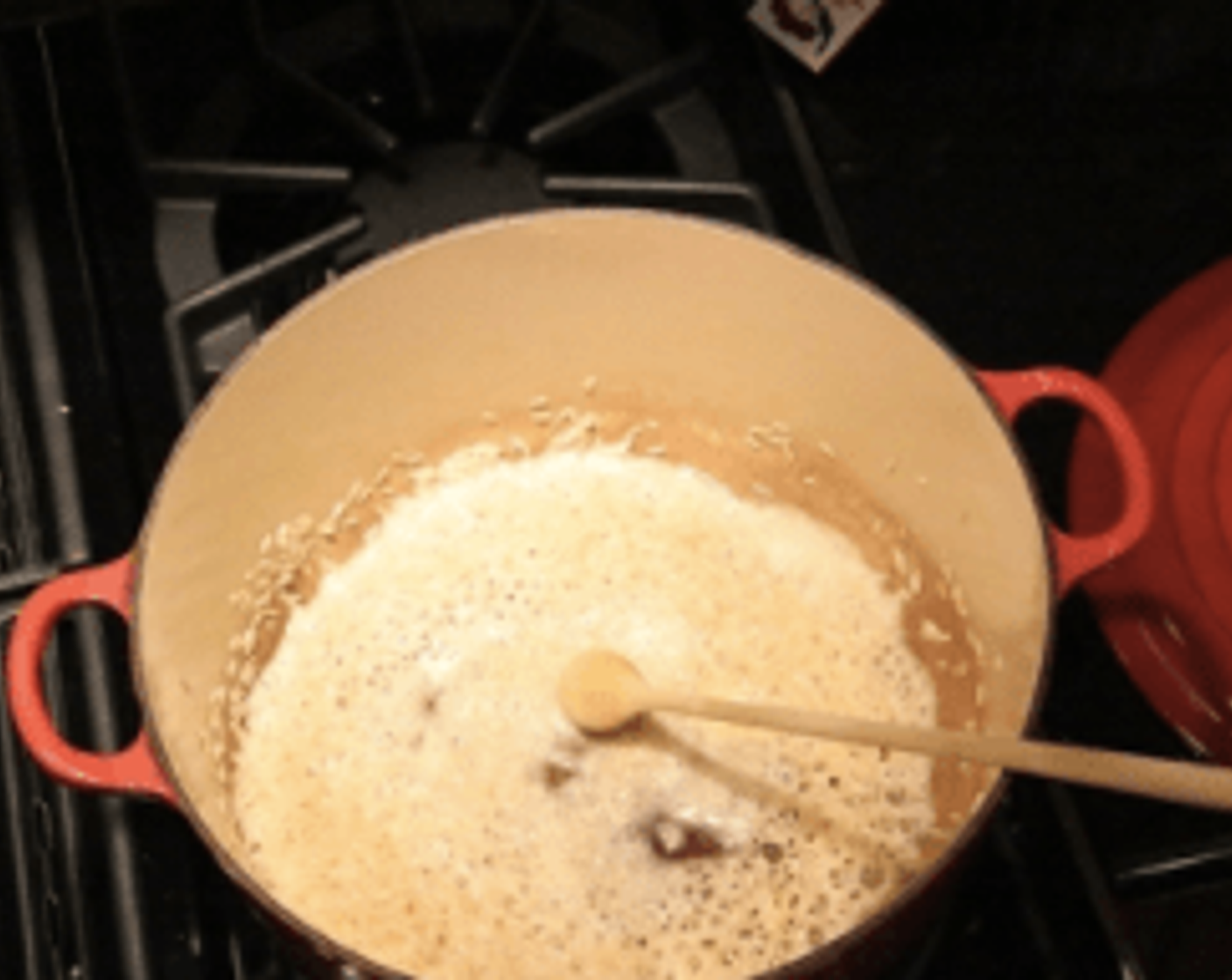 step 1 In a large dutch oven or sauce pot heat, then add Butter (1/4 cup) and Arborio Rice (3/4 cup), parch rice until it is all coated in the fat, toasting.