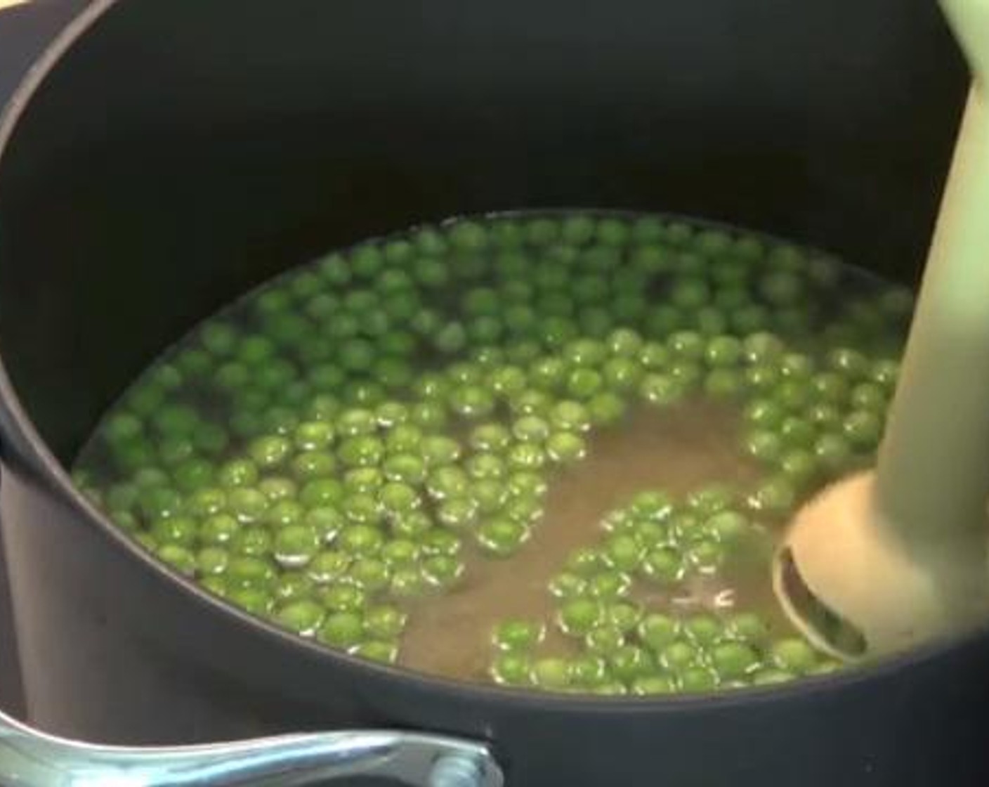 step 4 Add the Frozen Green Peas (2 cups) and give the soup a good stir. After about 2 minutes, use a stick blender to blend the soup in the pot.