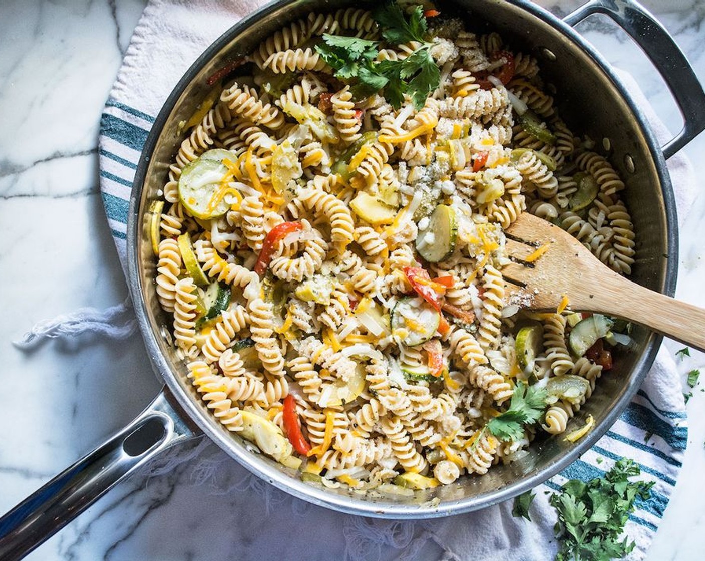 step 4 Once pasta has cooked, drain and add to vegetables. Stir until well combined.