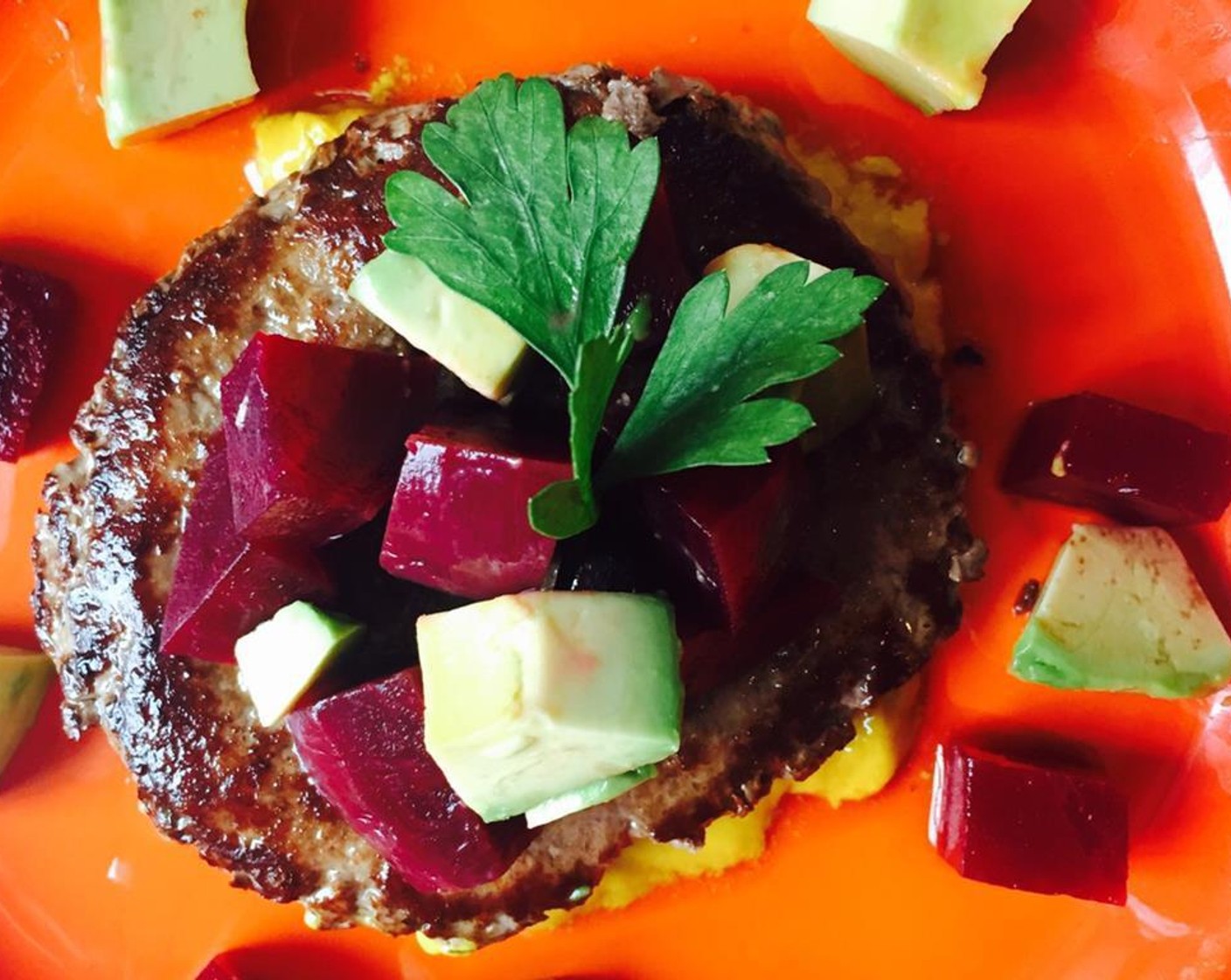 step 3 Spread the Yellow Mustard (2 Tbsp) on a plate. Lay the beef patty on top, and add the beet and avocado salad, garnish with Fresh Parsley (1 handful) and serve!