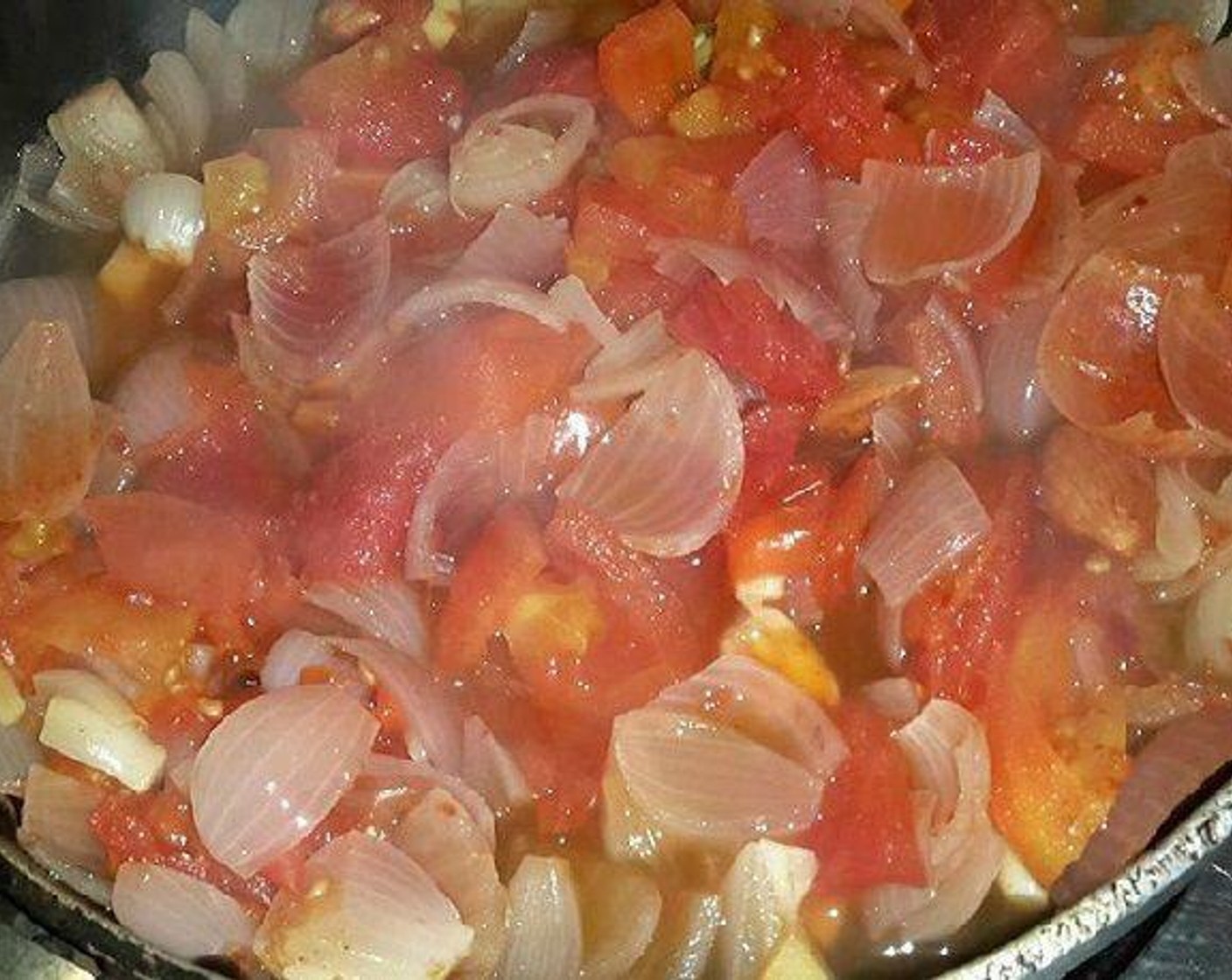 step 2 Add Cashew Nuts (5), Almonds (4), and boil for 10 to 12 minutes, when onion changes color and tomatoes become soft, mash with a spatula, and turn off the flame.