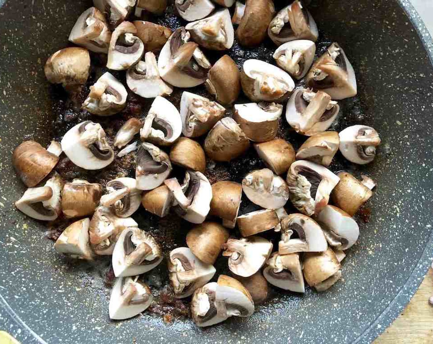 step 7 To make the sauce, add Olive Oil (1 Tbsp) to the same pan. Add the Cremini Mushrooms (2 1/4 cups) sauté until softened and browned for about 5 to 7 minutes.