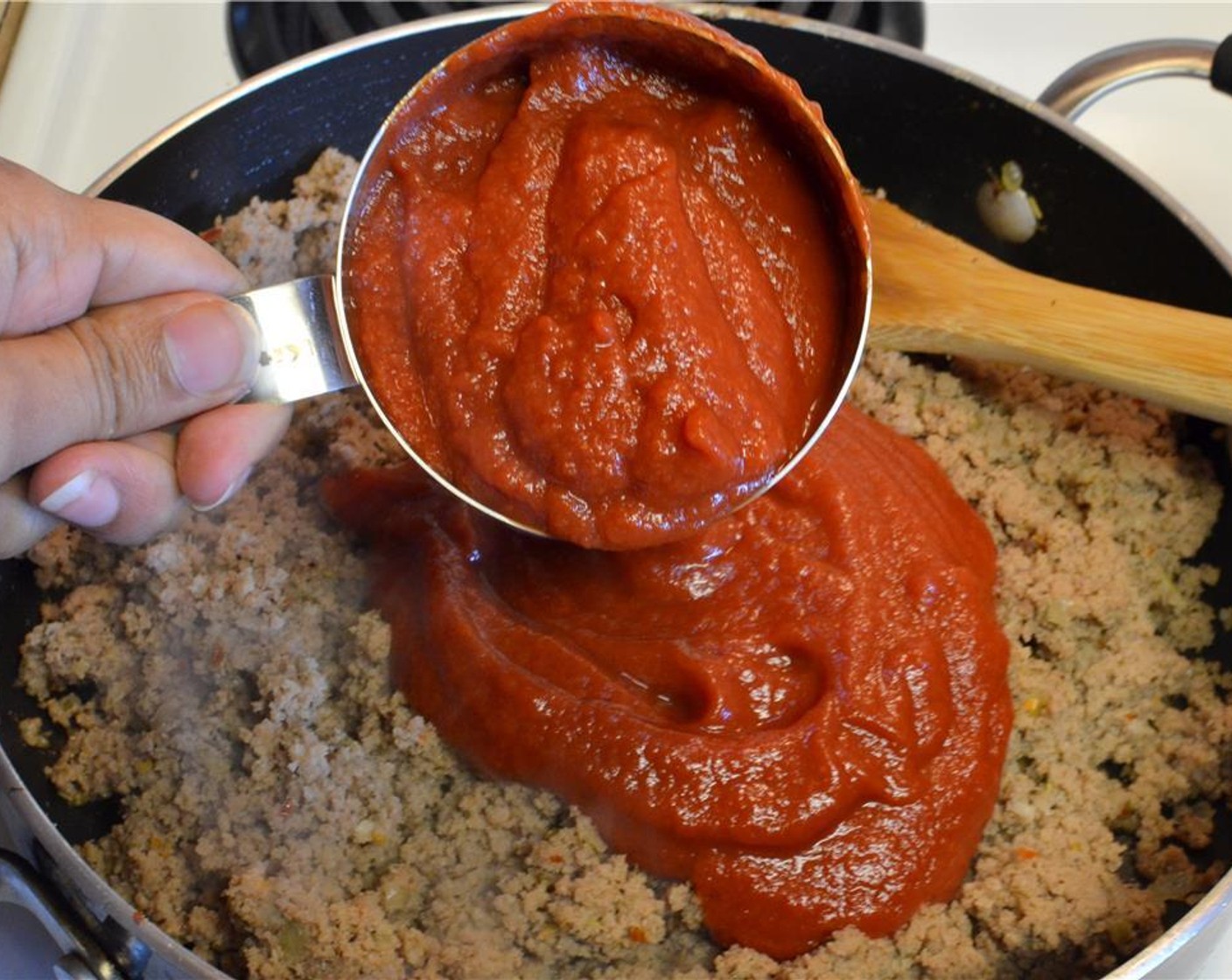step 6 Return the meat to the pan and add the Canned Crushed Tomatoes (2 cups). Let it simmer gently for about 10-15 minutes. Taste and check for seasoning.