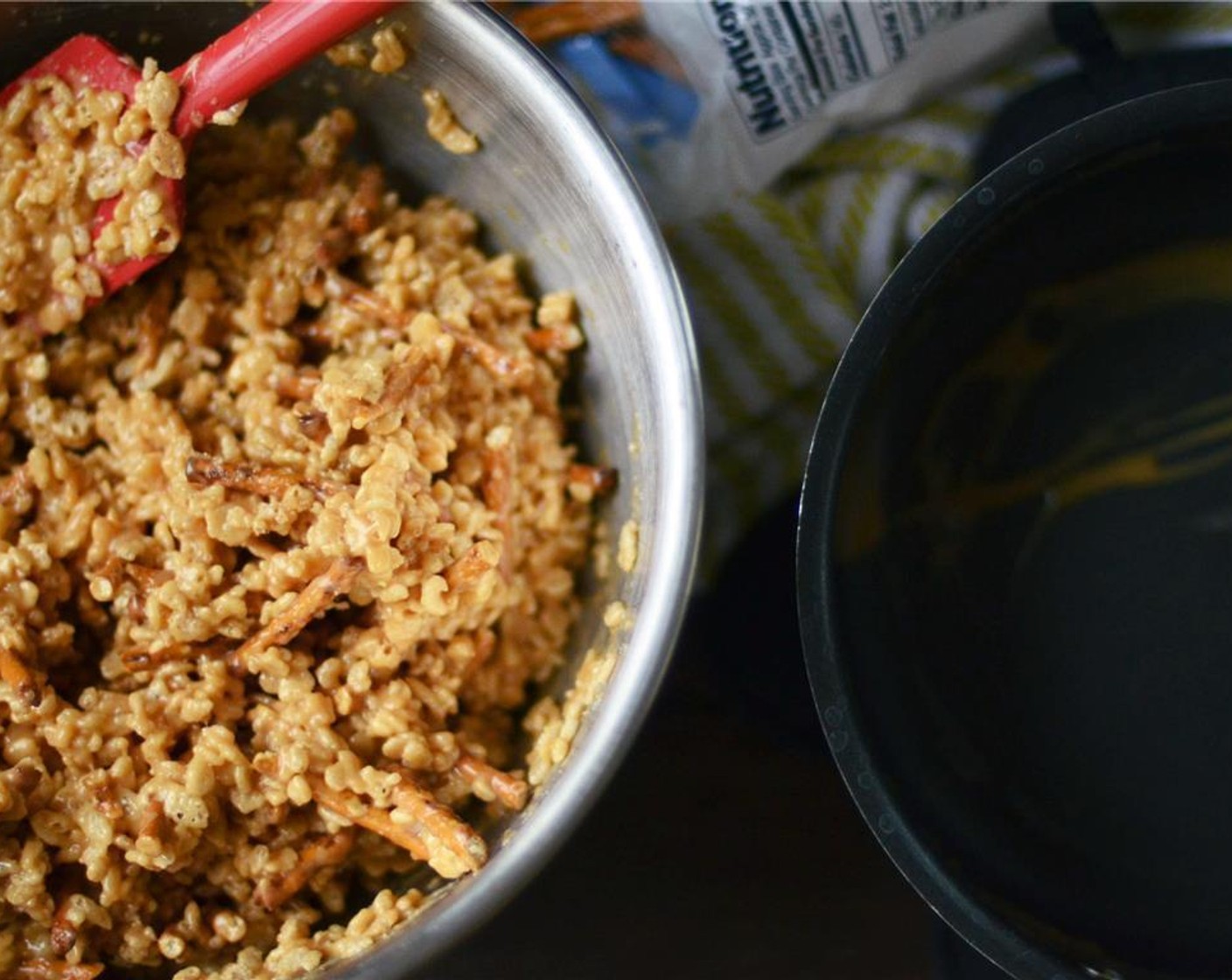 step 4 Remove from heat and immediately stir in Peanut Butter (1 cup) and Vanilla Extract (1 tsp). Stir until smooth. Pour hot peanut butter mixture over rice cereal and pretzels, stir with a wooden spoon until evenly combined.