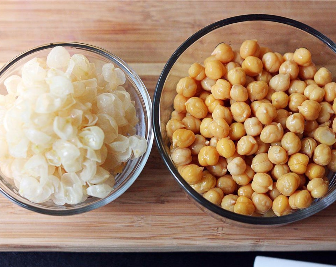 step 1 Remove skins from the Chickpeas (1 can). You can do this quickly and easily by placing the chickpea between the thumb and index finger with the pointy end toward your palm and squeezing gently until the chickpea pops right out.