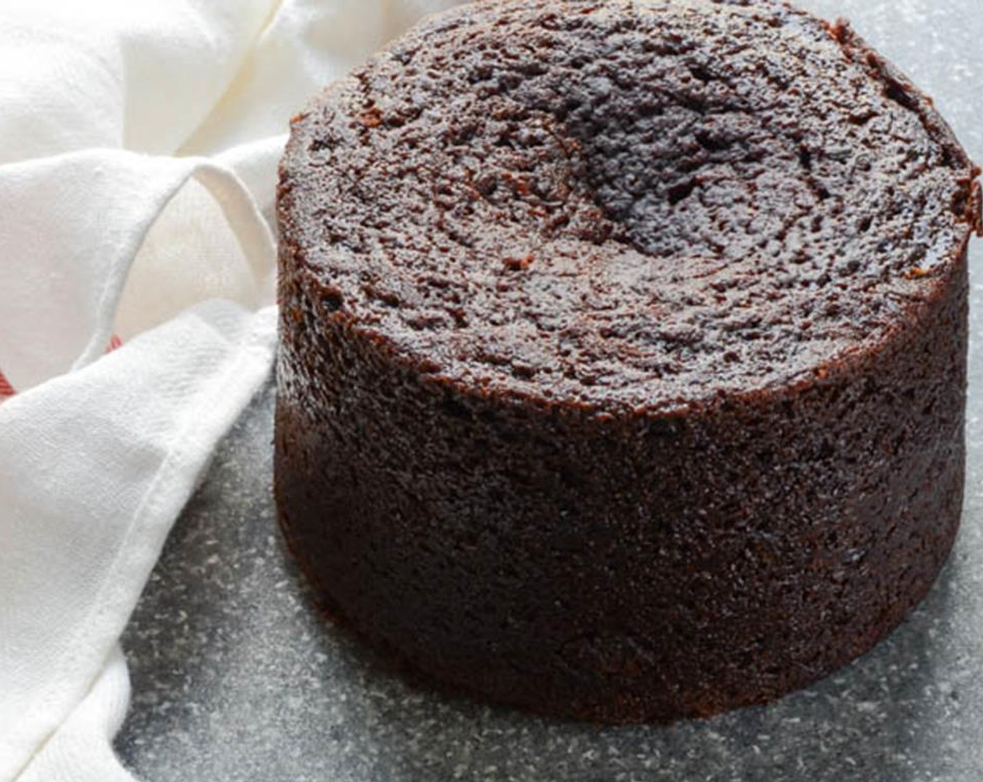 step 7 Cool to room temperature on a cake rack, then turn cake out onto a plate to frost.