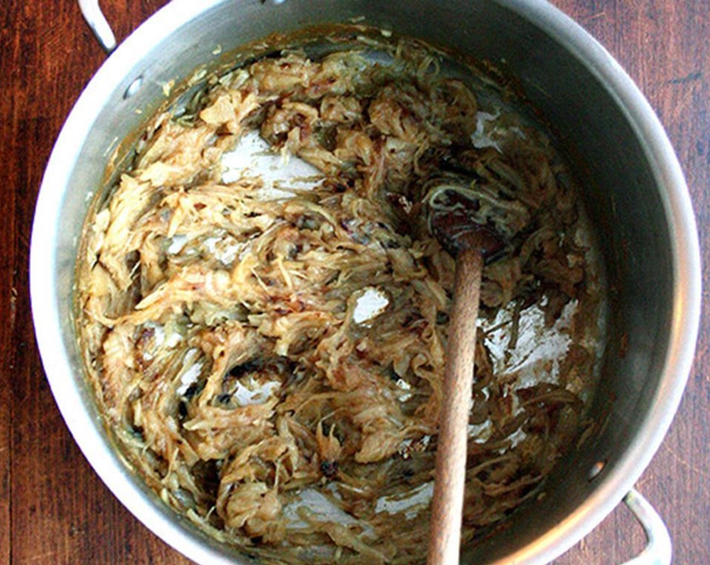 step 9 When the onions have completely cooked down, the water has cooked off, and the onions have turned amber, add Water (6 cups). Raise the heat to high and bring the soup to a simmer, then reduce the heat to low.