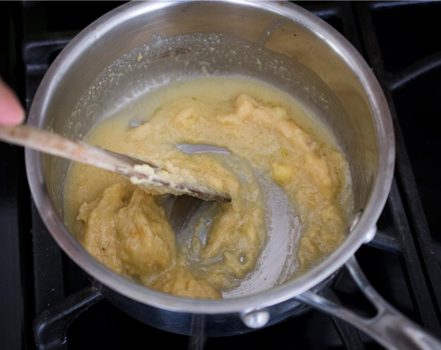 step 6 In a small sauce pan over medium heat, warm 1 tbsp of the Rice Vinegar (2 Tbsp) for a minute. Turn the heat to low and add half of the roasted garlic – miso butter.  Stir until warmed through, but not melted. Set aside and keep warm.