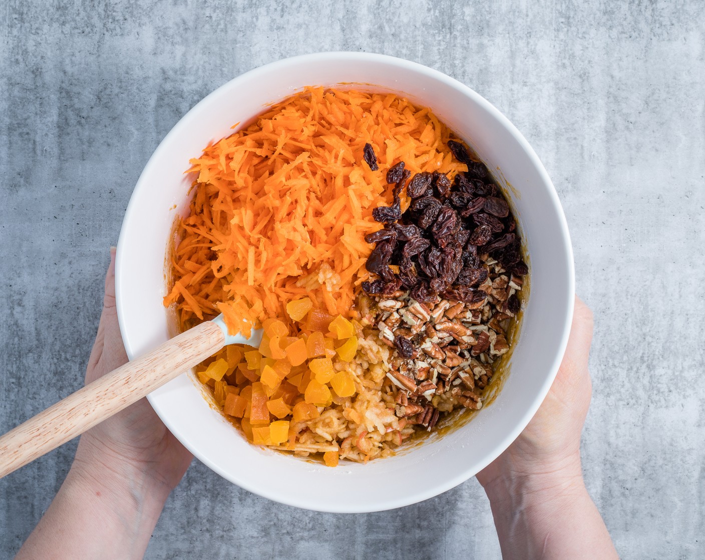 step 5 Add the Carrots (4), Apple (1), Raisins (1/3 cup), Dried Apricot (1/3 cup), and Pecans (1/2 cup). Gently mix everything together just until combined and no streaks of flour remain.