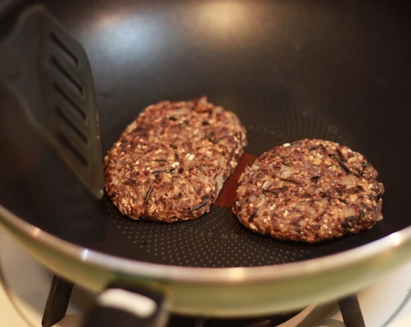 step 9 If you are making veggie burgers, grill the veggie meat with medium high heat. Wait until it turns a little bit brown and crunchy on the outside.