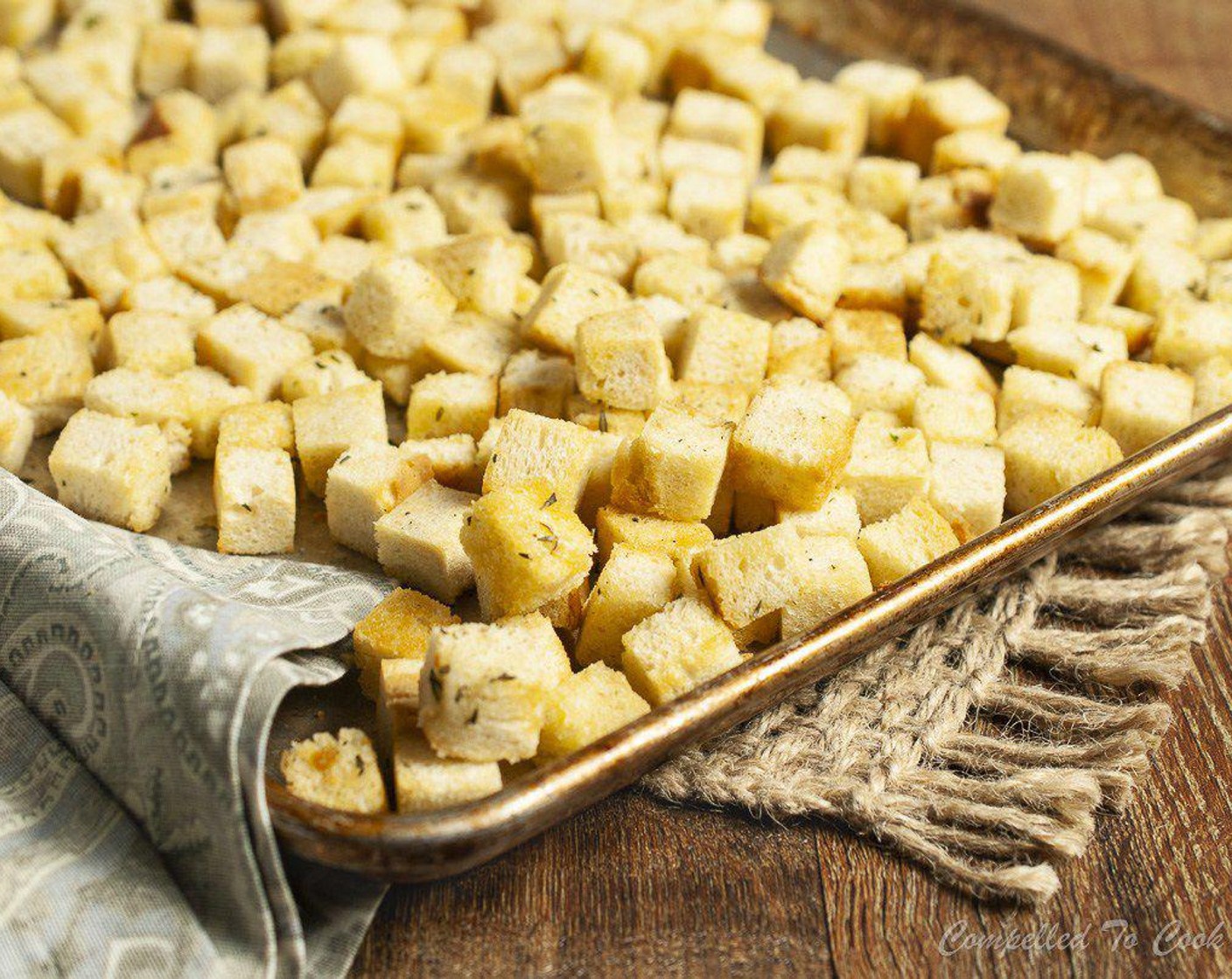 step 5 Spread evenly in a single layer on a large baking tray and bake for 18 to 20 minutes until golden, turning once or twice. Remove from oven and return bread cubes to same large bowl.