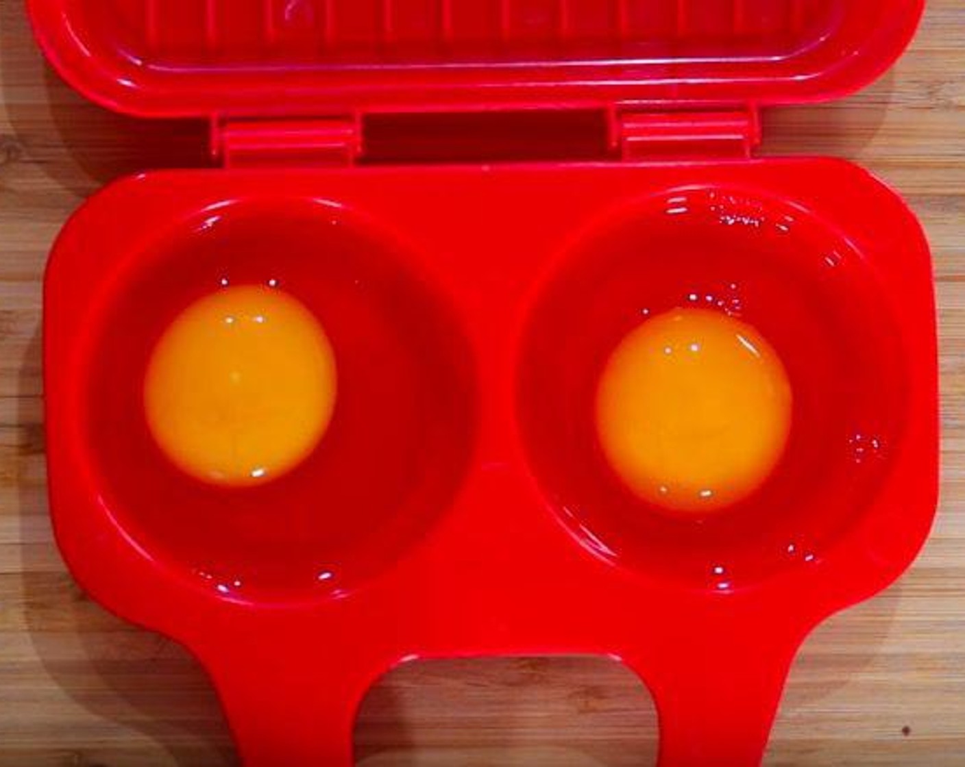 step 5 Crack Eggs (2) into an egg poacher. Microwave for 1 minute, or until cooked through.