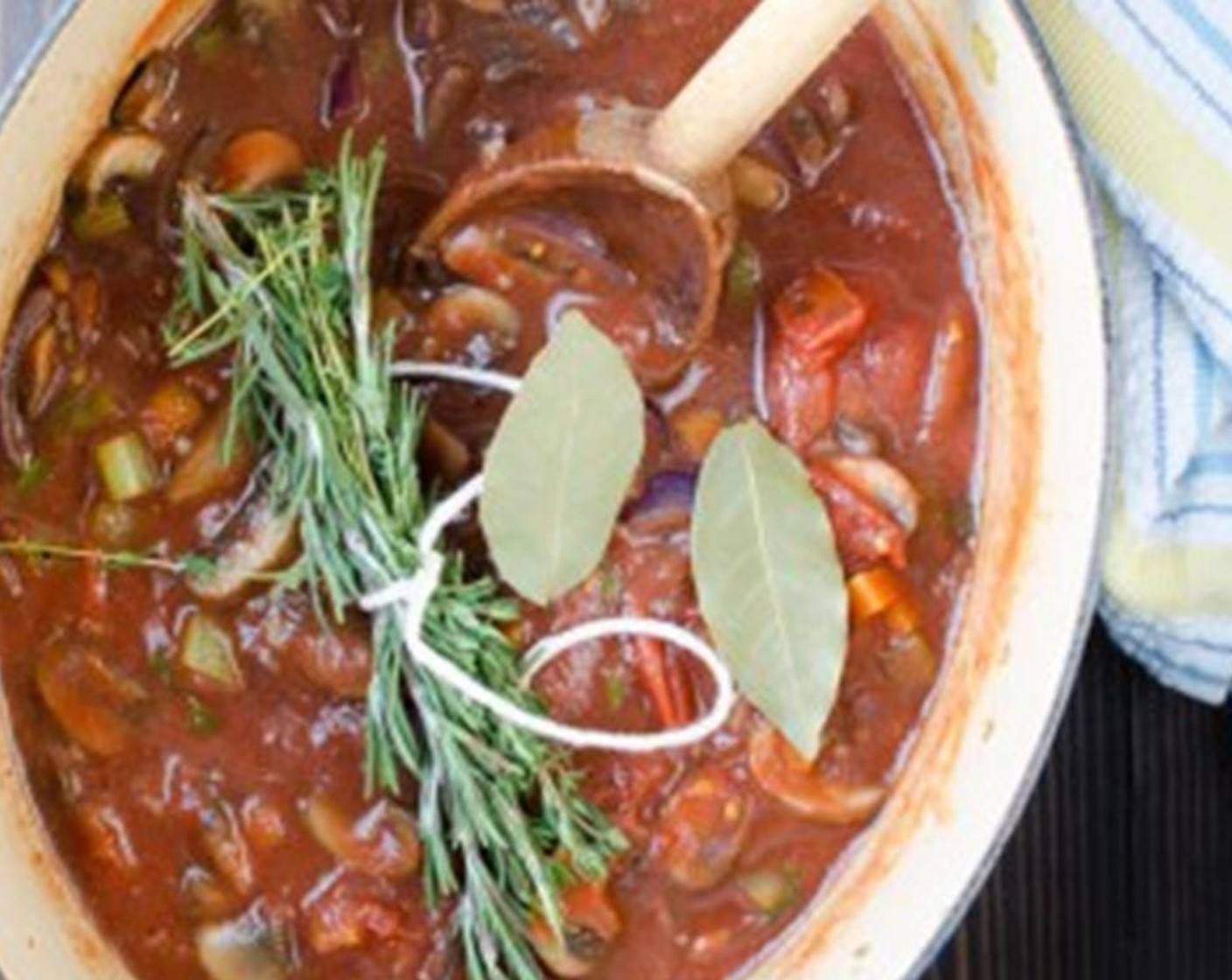 step 6 Tune the Fresh Rosemary (2 sprigs) and Fresh Thyme (4 sprigs) into a bundle using a piece of kitchen string or twine. Add them to the vegetables along with the Bay Leaves (2).