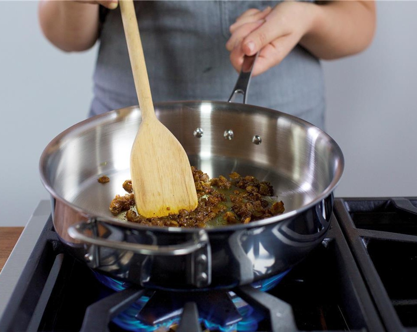 step 13 When the oil is hot, add the red onion and remaining fresh ginger. Saute for 11 minutes until onions are soft and slightly caramelized.