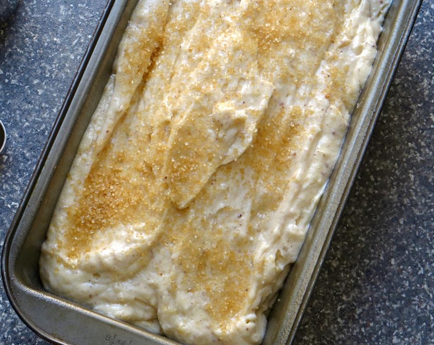 step 10 Pour the batter into the prepared loaf pan and smooth the top. Sprinkle the top of the loaf evenly with Demerara Sugar (2 Tbsp), if desired for a slightly crunchy top.