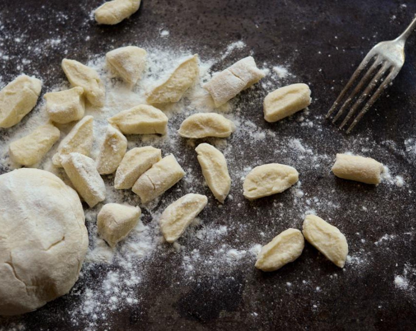 step 8 Using a lightly floured knife, cut the logs into 2 cm pieces. Here you can either opt for classic gnocchi and roll each dumpling over a floured fork to achieve the identifiable indentations or you could leave the gnocchi as it and sauce them in a little butter instead of boiling.