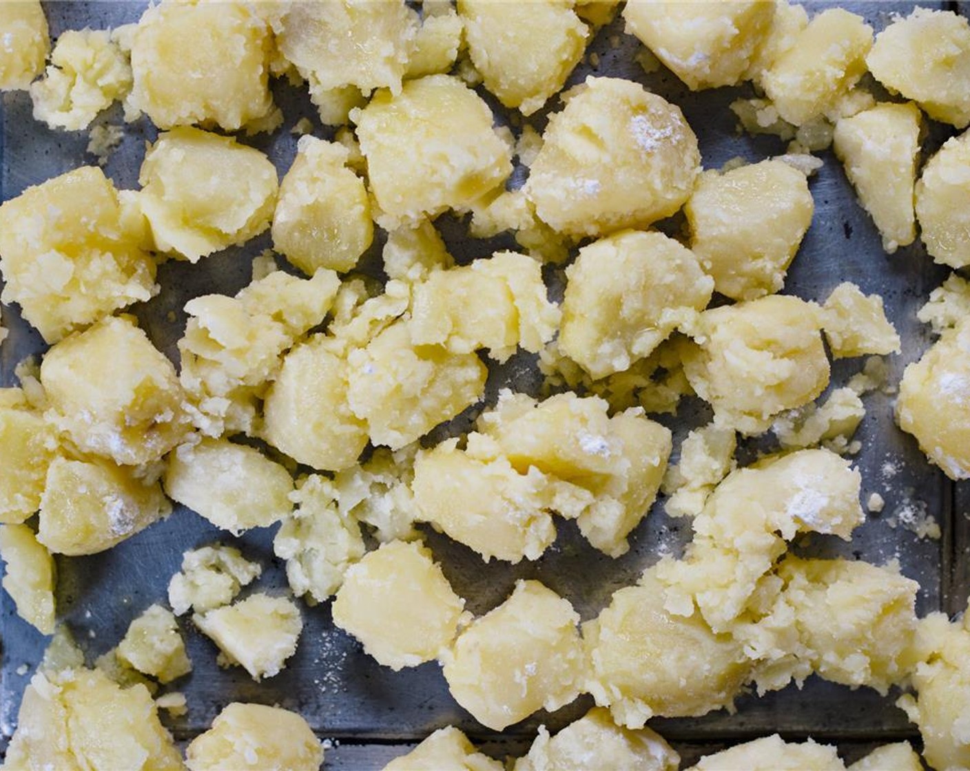 step 12 Spread russet potatoes onto baking tray.