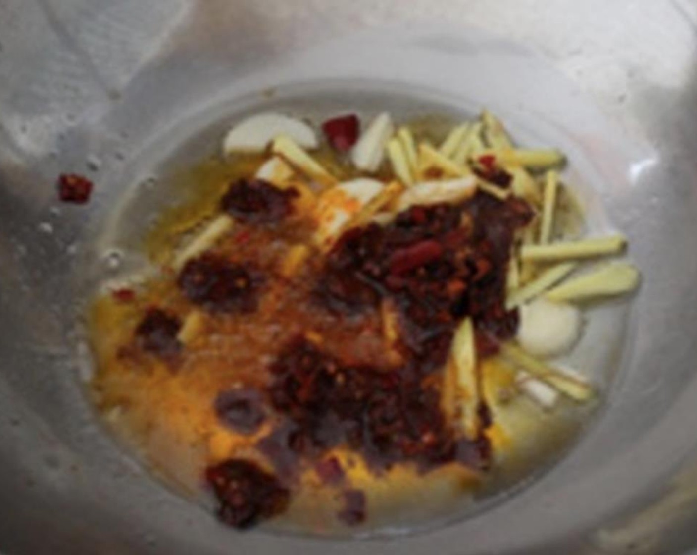 step 4 Add Chili Bean Sauce (1 Tbsp). Fry until fragrant. Add Star Anise (to taste), Fennel Bulb (1/2 tsp), Cinnamon Sticks (to taste), Dried Chili Pepper (1 Tbsp) and Sichuan Peppercorns (1 tsp).