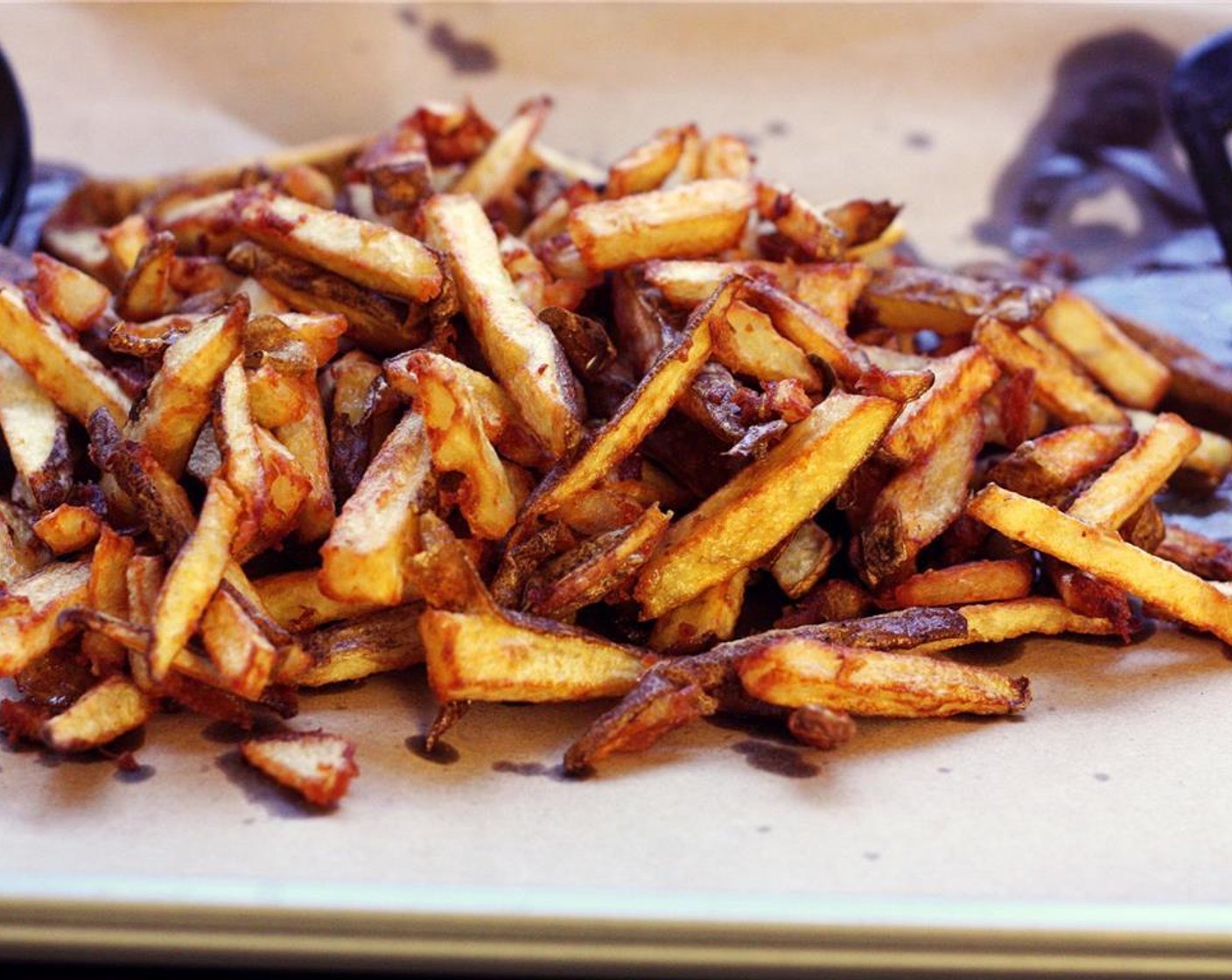 step 9 Keeping the fries on the cookie sheet, season lightly with Salt (to taste) and Ground Black Pepper (to taste). Toss fries to evenly distribute the seasoning and add more salt and pepper as needed.