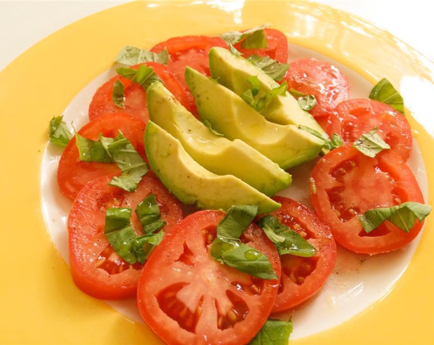 step 2 Arrange the slices, creating a fun pattern with the Arugula (1 pckg) on your plate. Shred a few leaves from the Fresh Basil (1 sprig). Whisk together Olive Oil (3 Tbsp) and the juice of one Lemon (1); drizzle on the salad with some basil leaves.