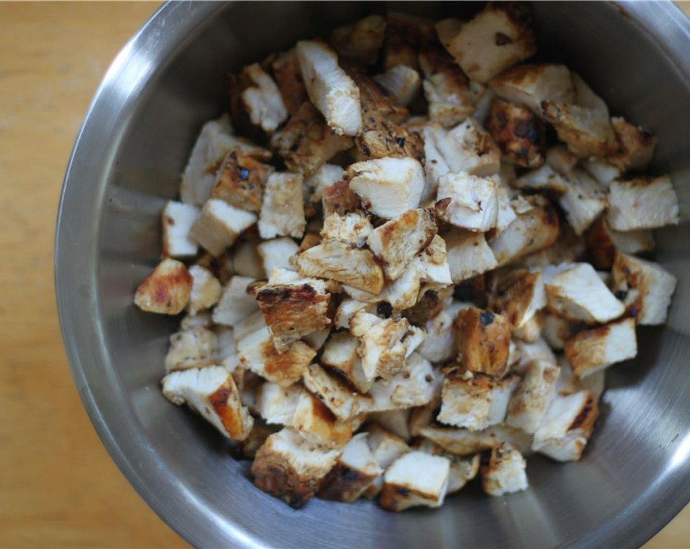 step 6 When the chicken is cool enough to handle, chop it into 1-inch cubes.