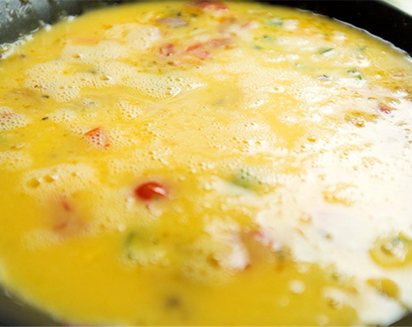 step 5 In a separate bowl, combine the Farmhouse Eggs® Large Brown Eggs (9), Salt (1/4 tsp), and Ground Black Pepper (1/8 tsp) in the bowl and whisk together. Pour egg mixture into pan over veggies stirring gently.
